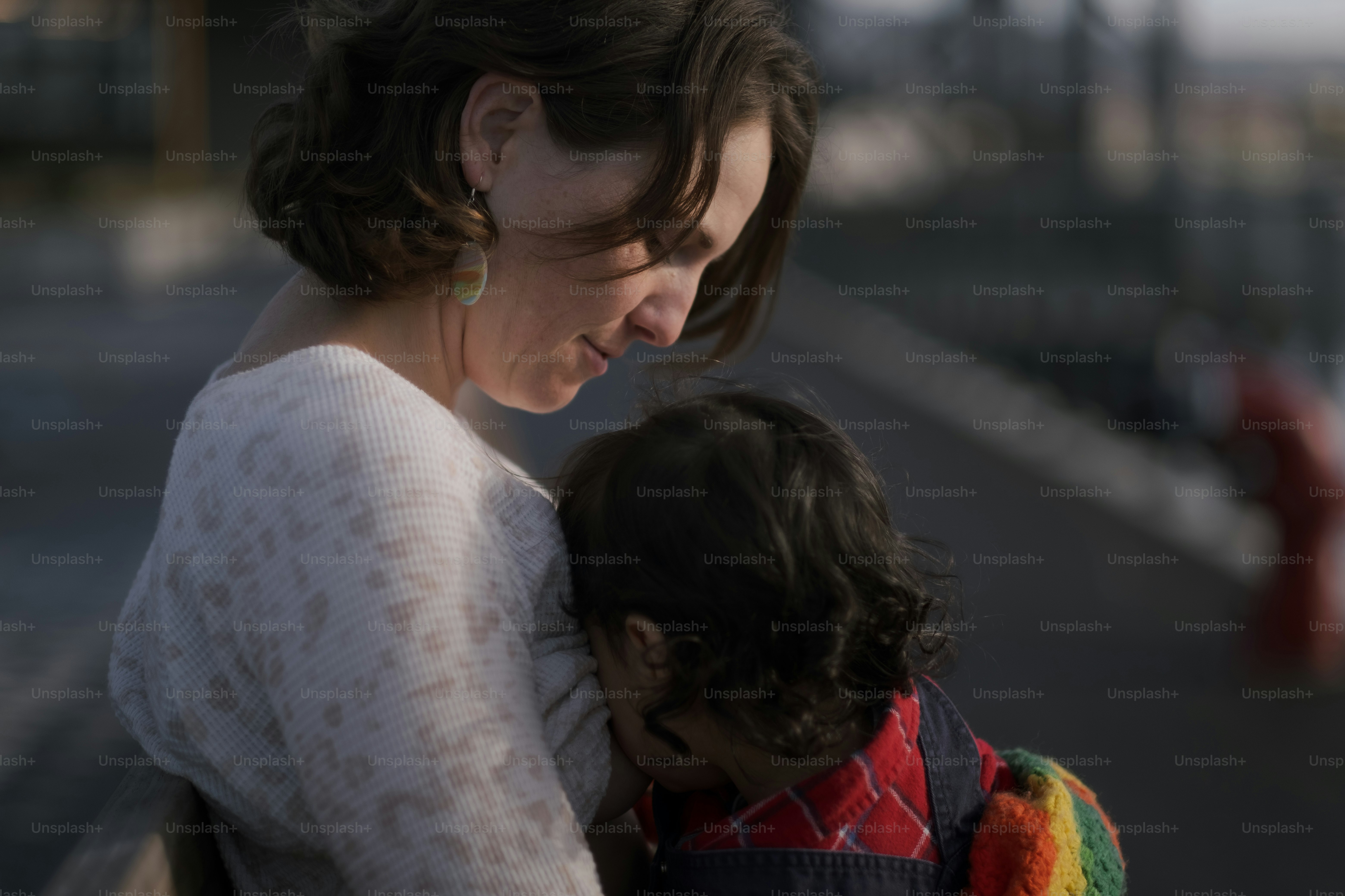 a woman holding a small child in her arms