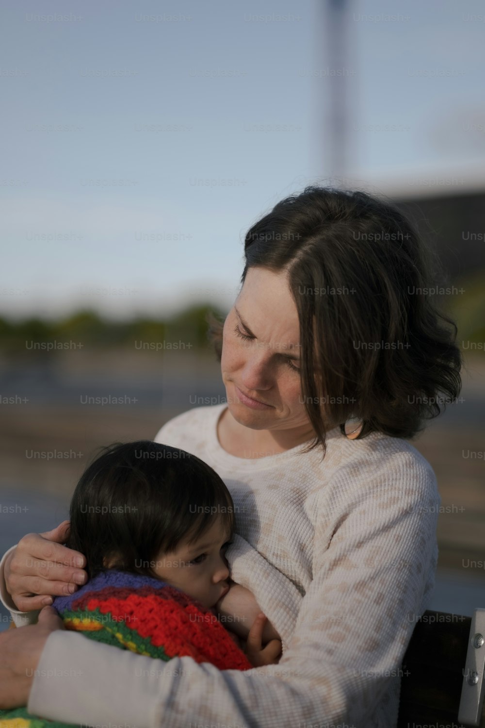 a woman holding a small child in her arms