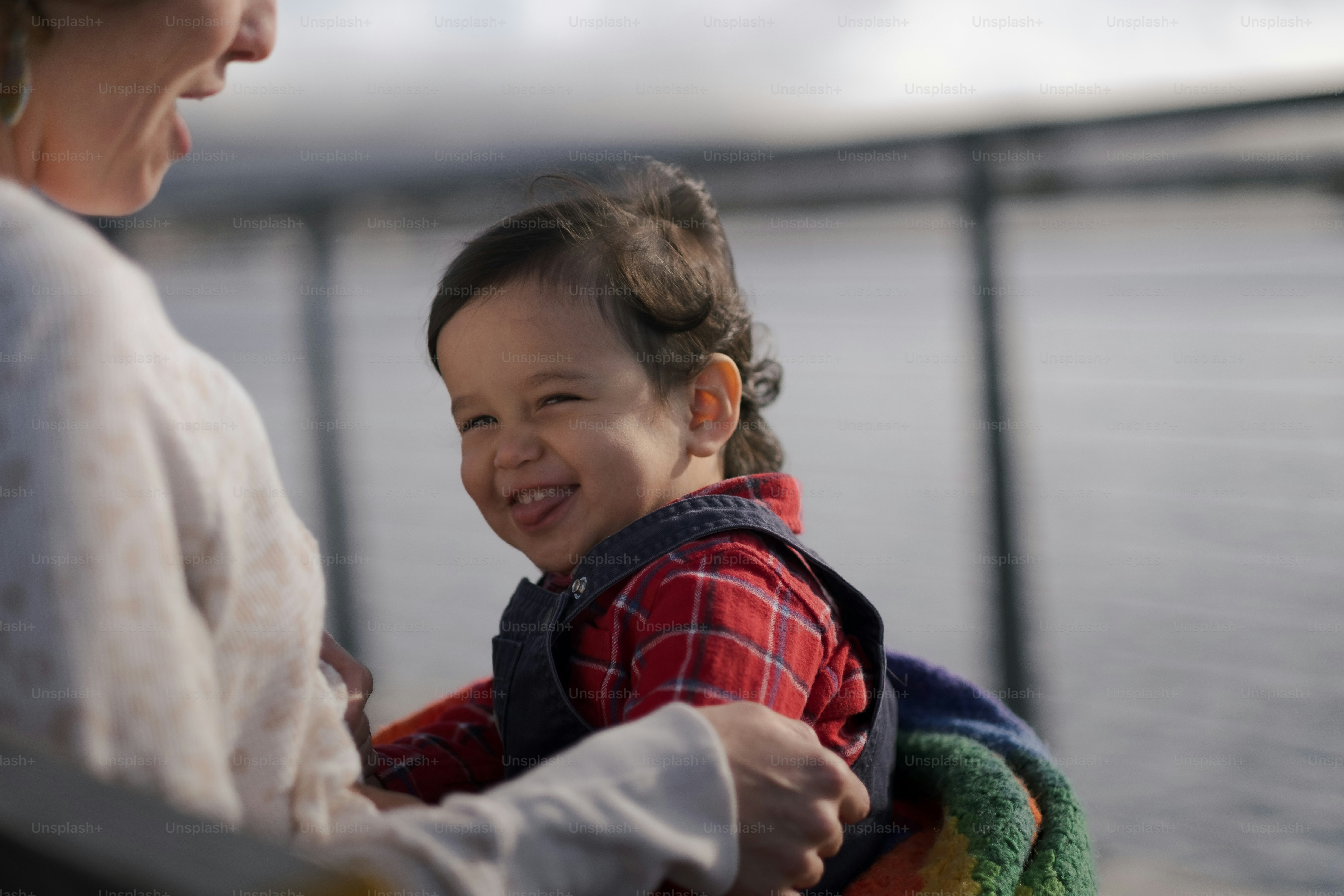 a woman holding a small child in her arms