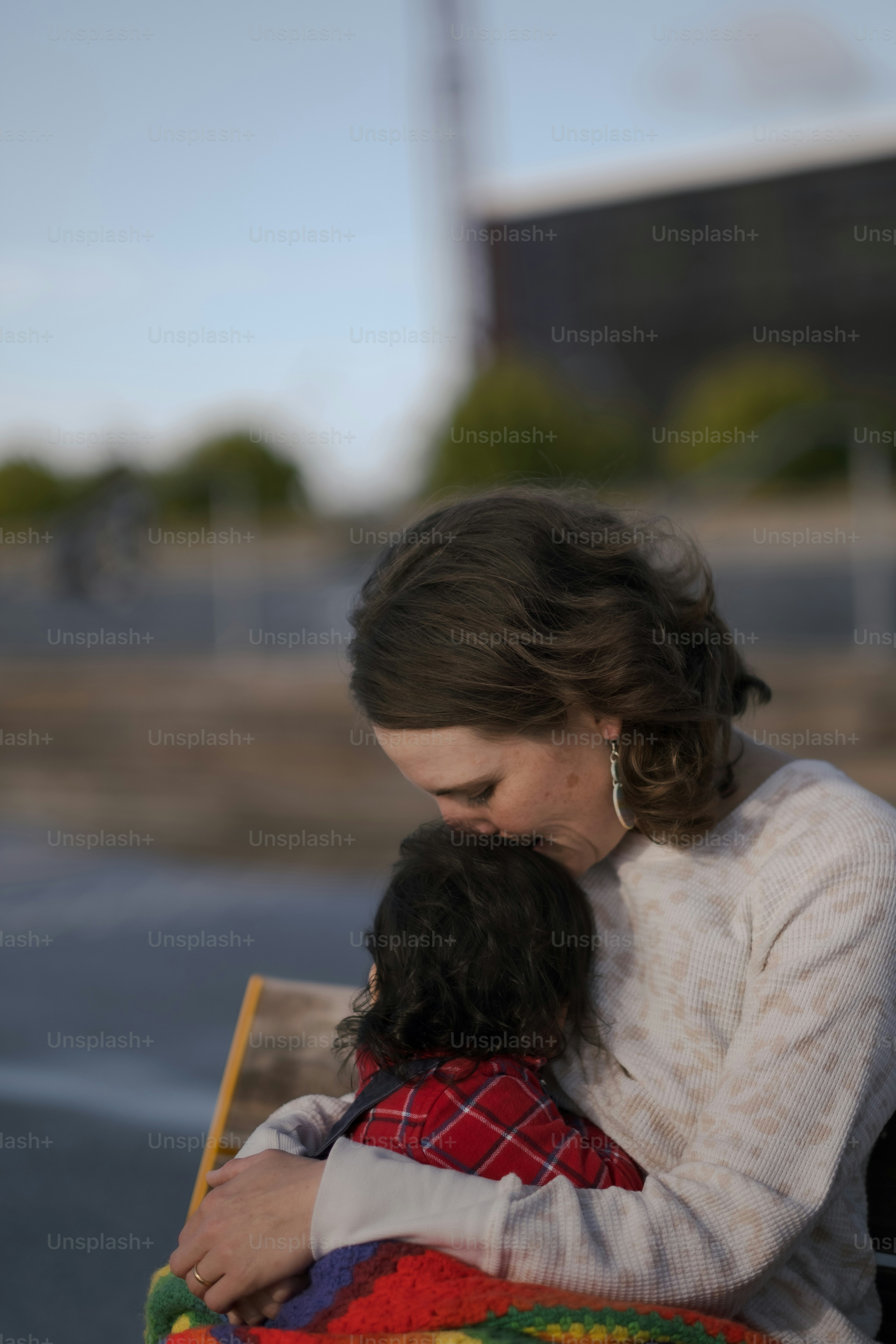 a woman holding a small child in her arms
