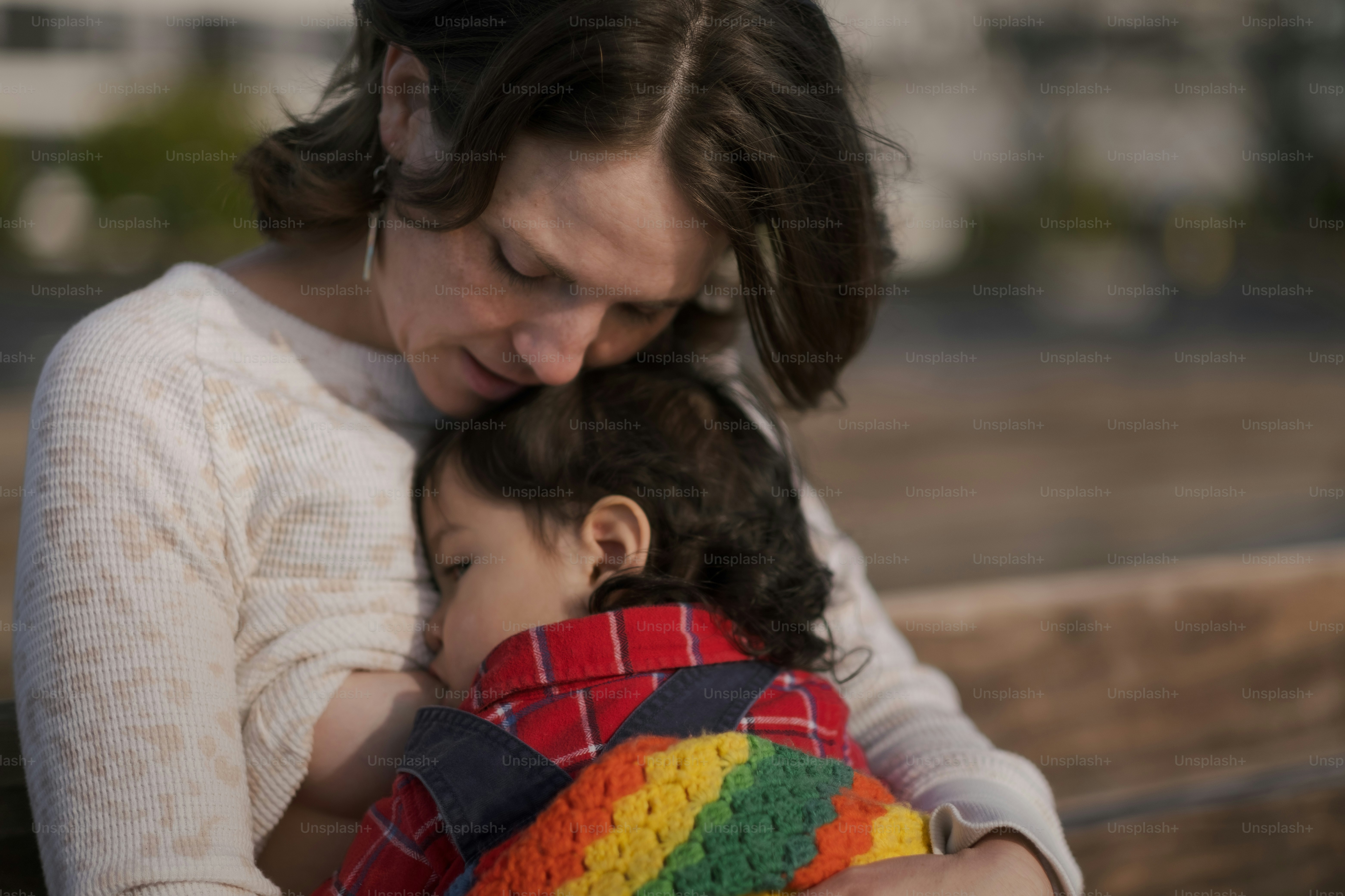 a woman holding a child in her arms