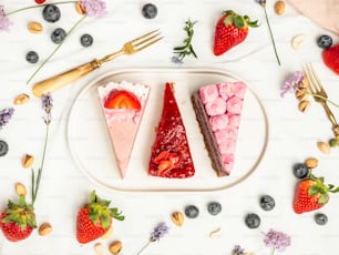 a white plate topped with two slices of cake