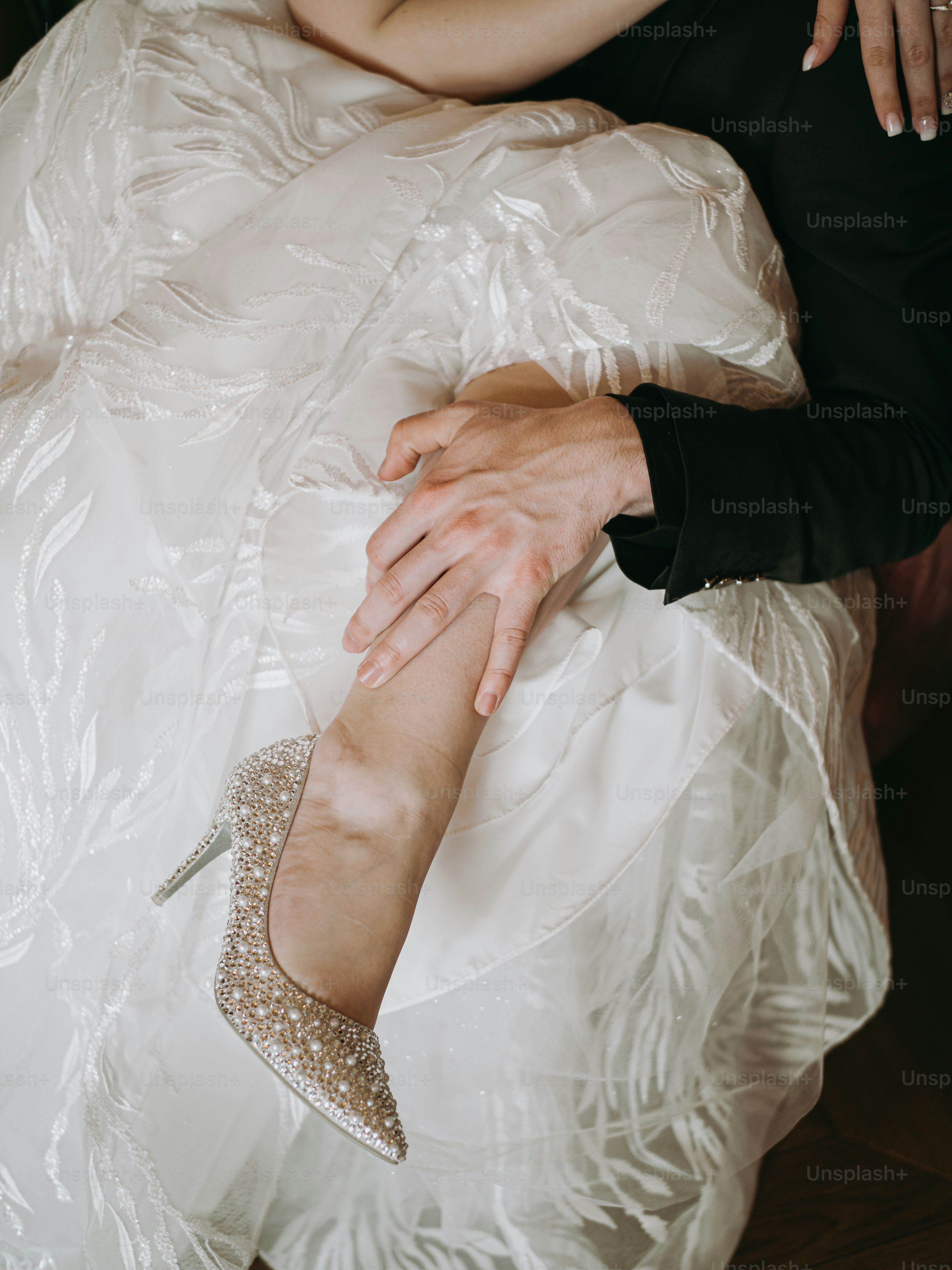 a woman in a white dress and a man in a black suit