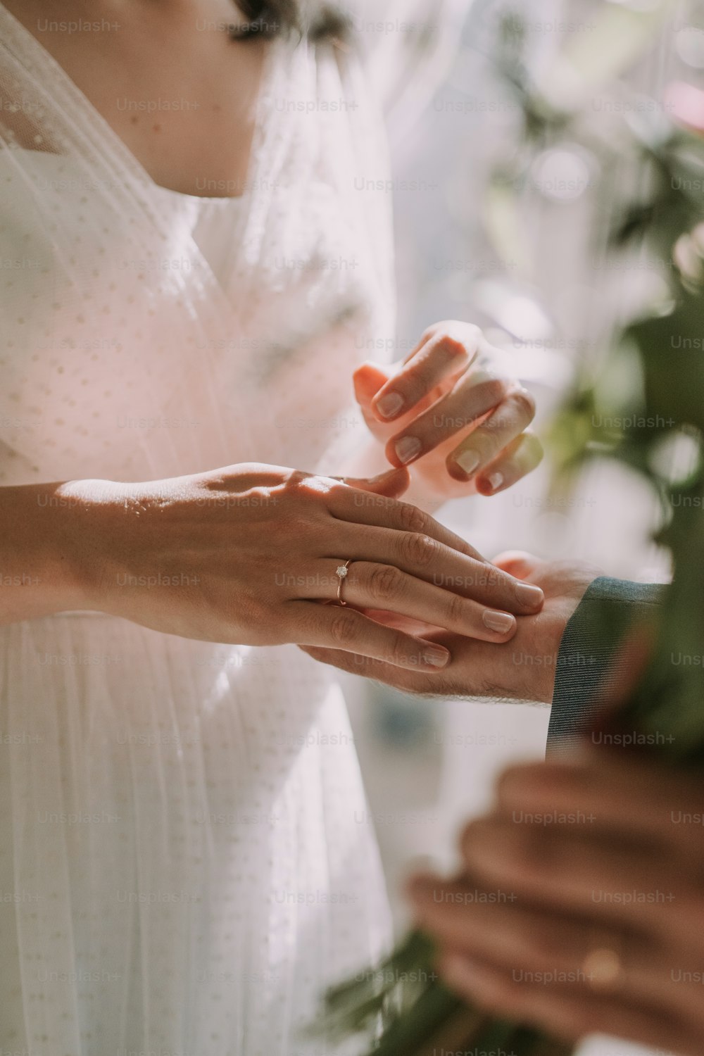 a close up of a person holding another person's hand