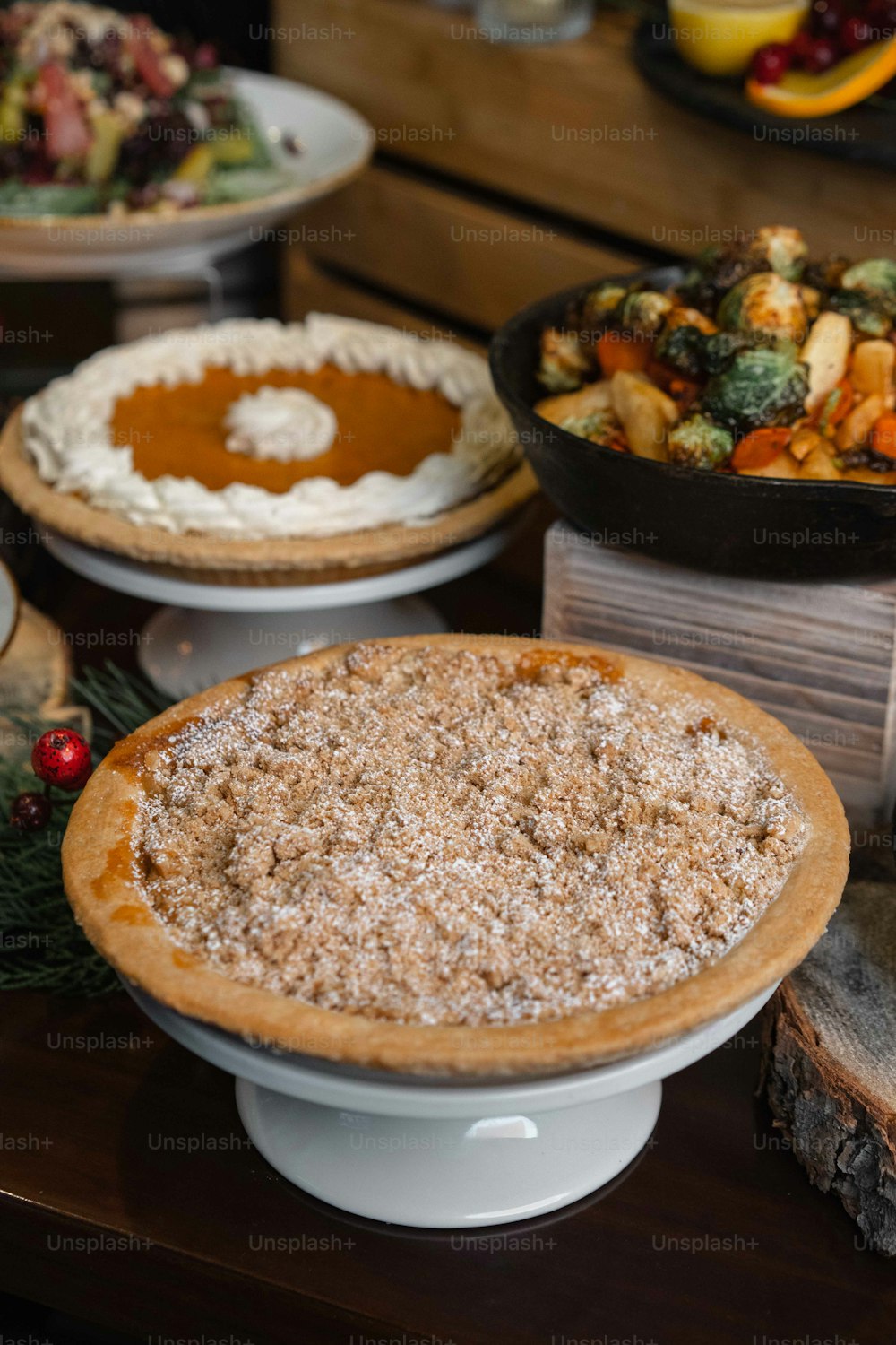 a table topped with pies covered in toppings