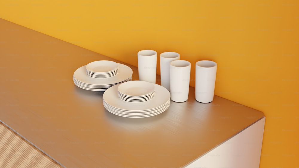 una mesa cubierta con platos y tazas blancas