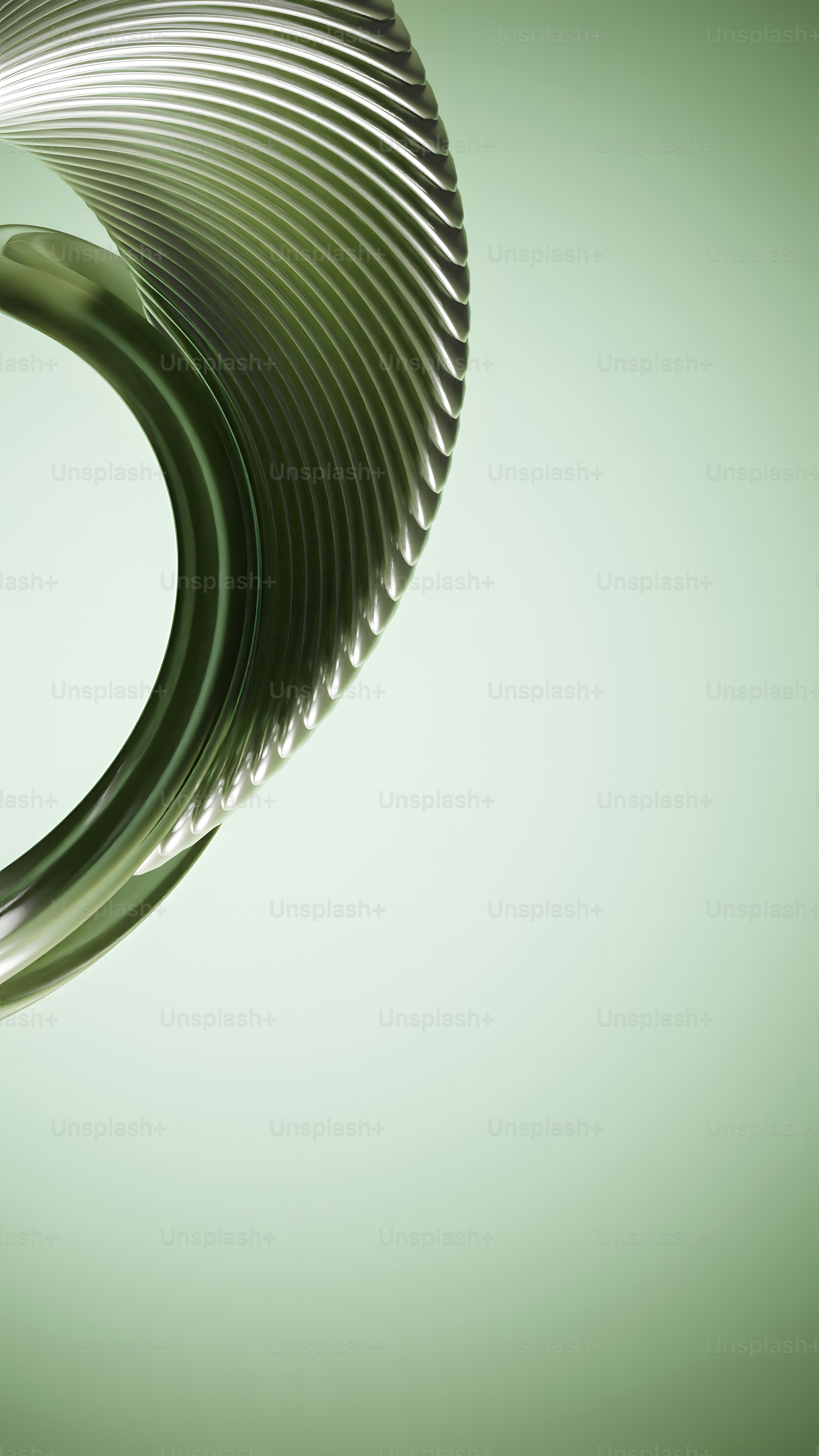 a close up of a metal object on a green background