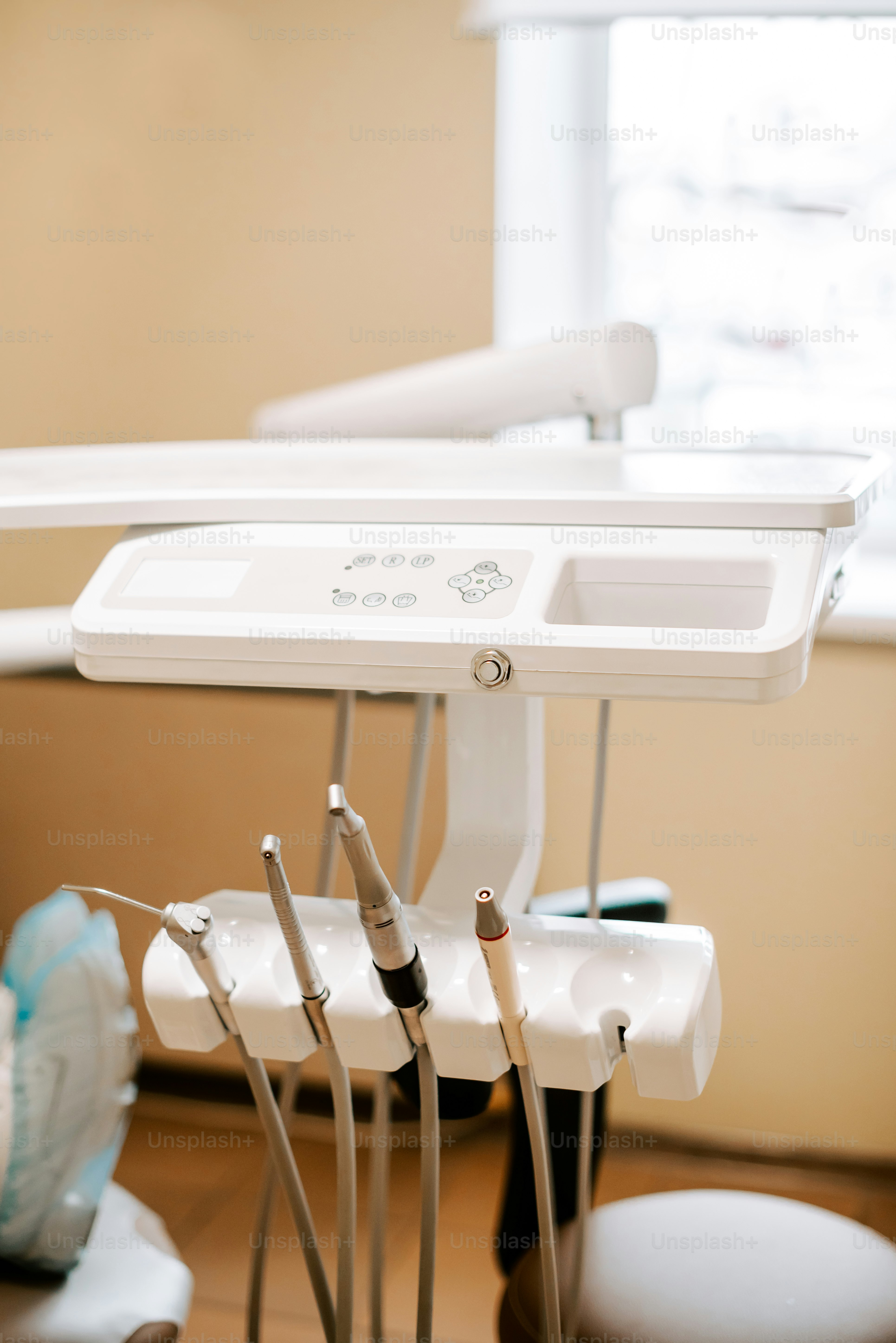 a dentist's chair with dental tools in it