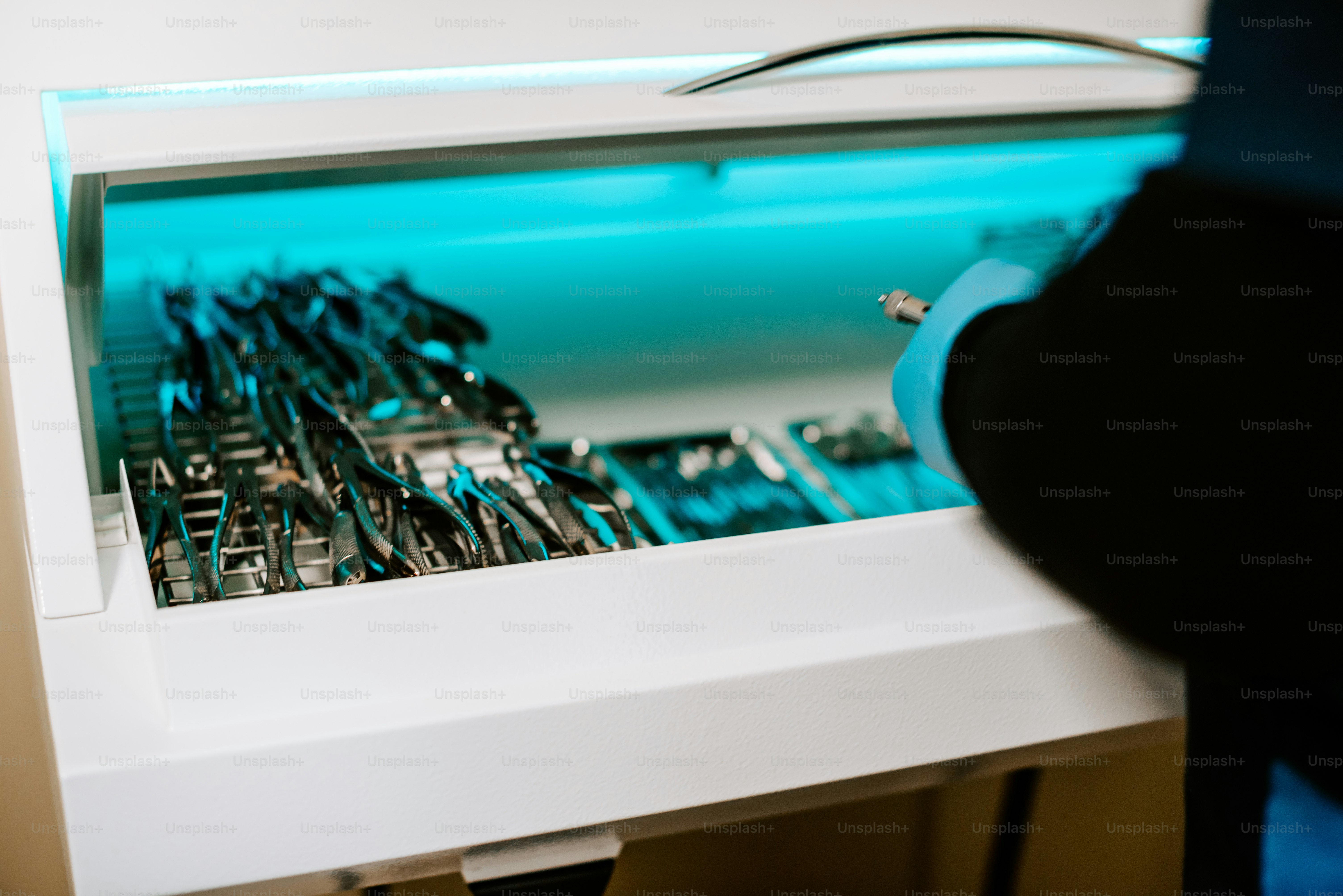 a close up of a microwave oven with a bunch of scissors in it
