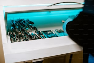 a close up of a microwave oven with a bunch of scissors in it