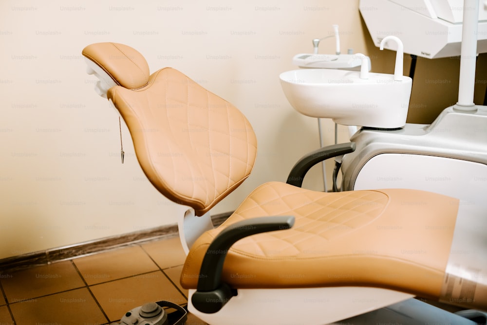a dentist's office with a chair and a sink