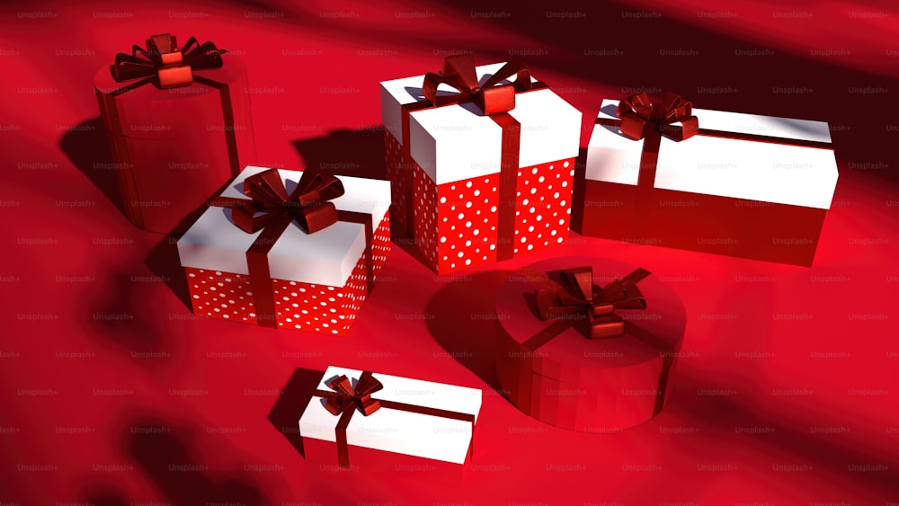a group of red and white gift boxes with bows