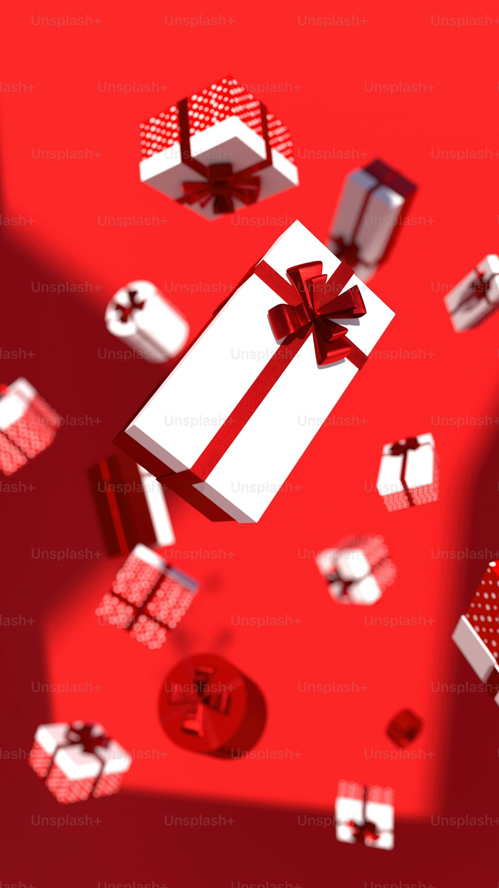 a red and white gift box with a red bow
