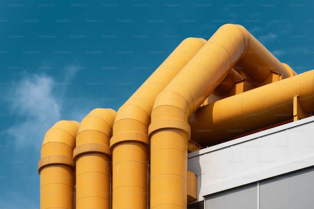 a large yellow pipe on top of a building