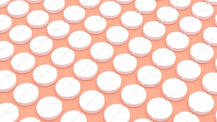 a large group of white pills sitting on top of a pink surface