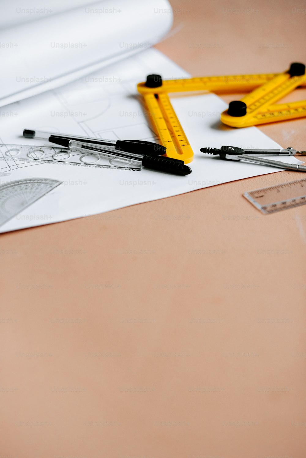 a pair of scissors, a ruler, and a ruler on a table