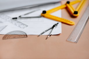 a pair of scissors, a ruler, and a ruler on a table