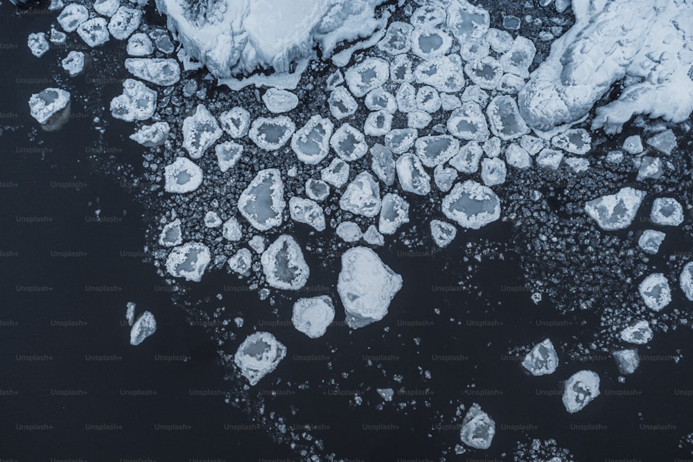 an aerial view of ice chunks and water