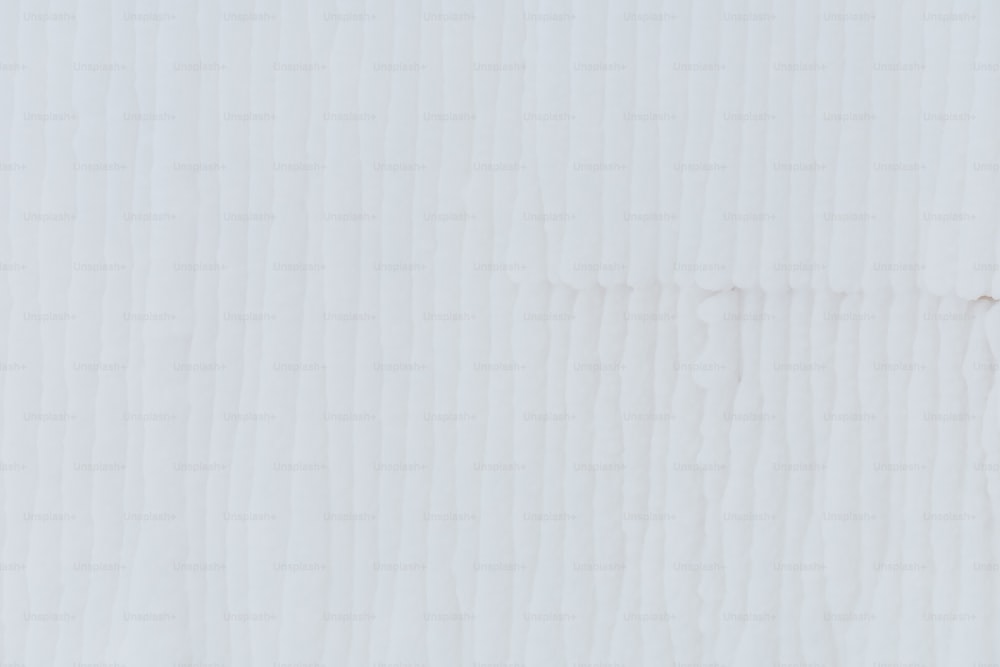 a close up of a white textured paper background