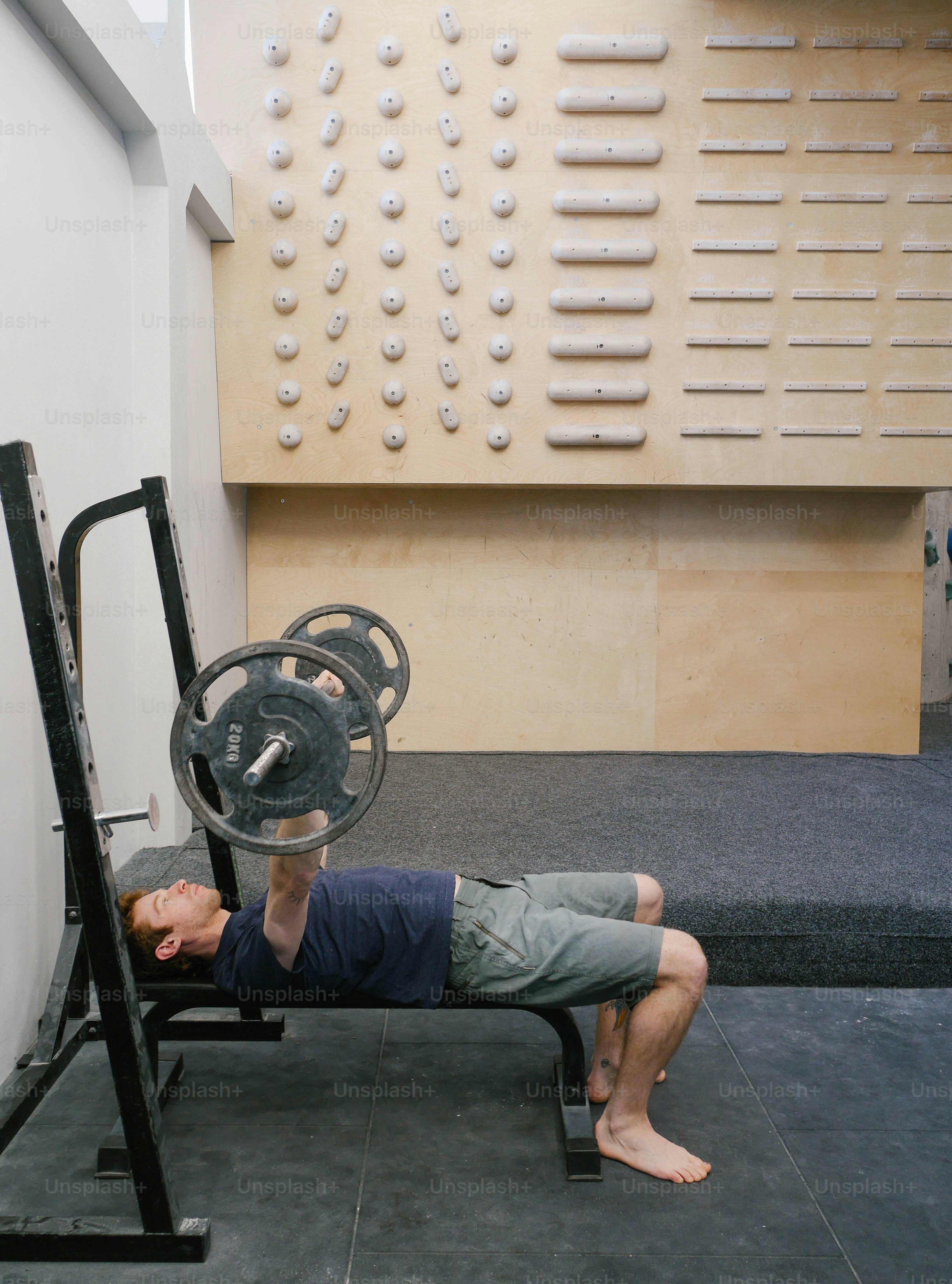 a man is doing a bench press exercise