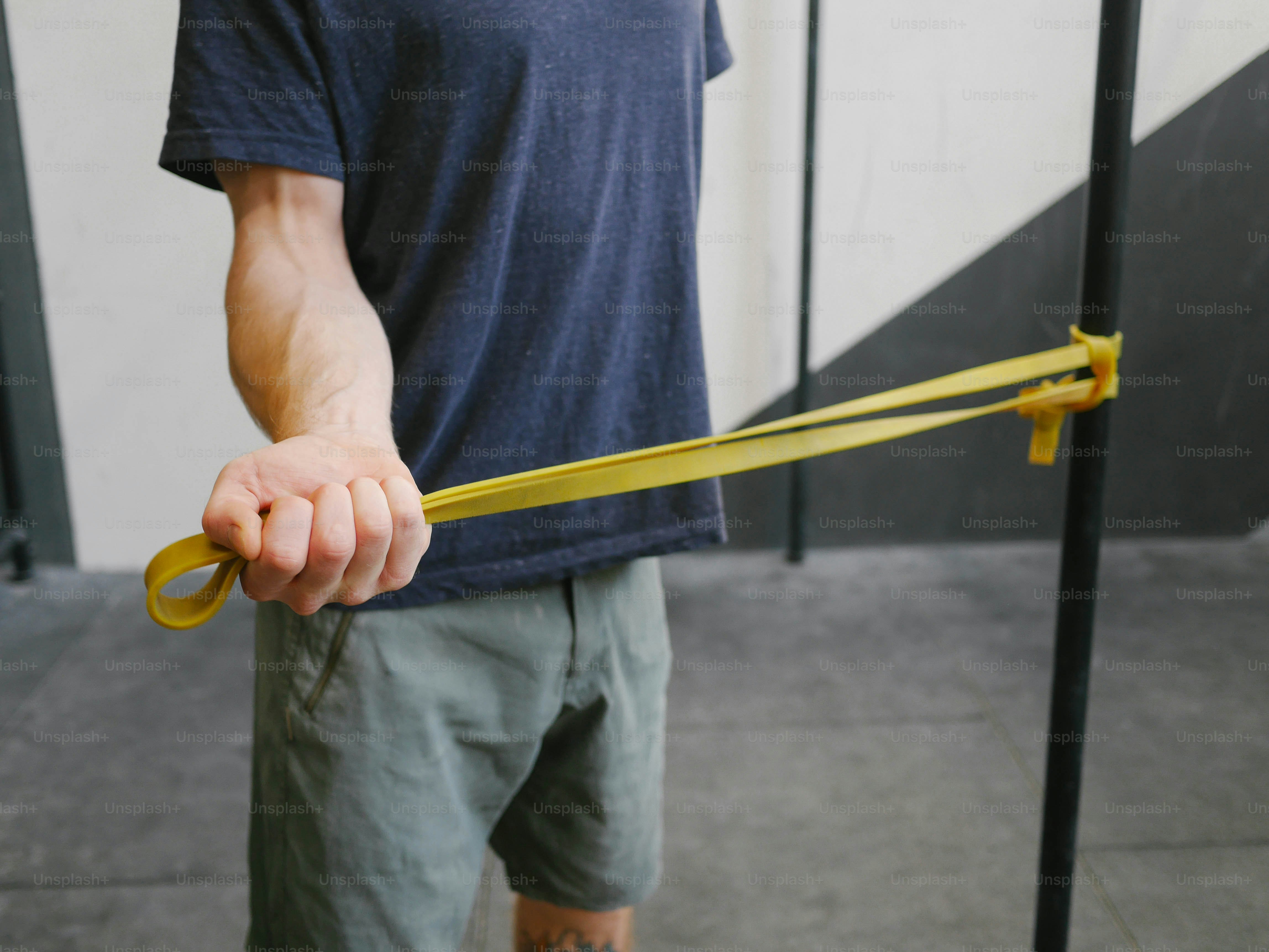 a man holding a pair of scissors in his hand