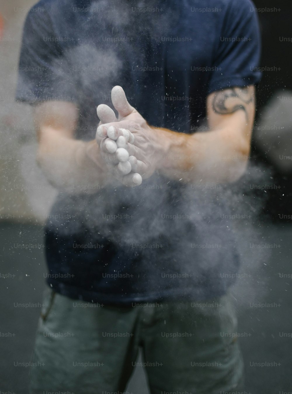 a man holding a bunch of pills in his hands