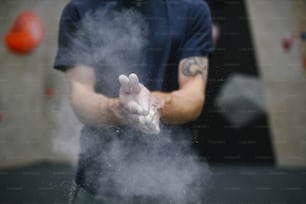 a man holding out his hands with a lot of smoke coming out of it