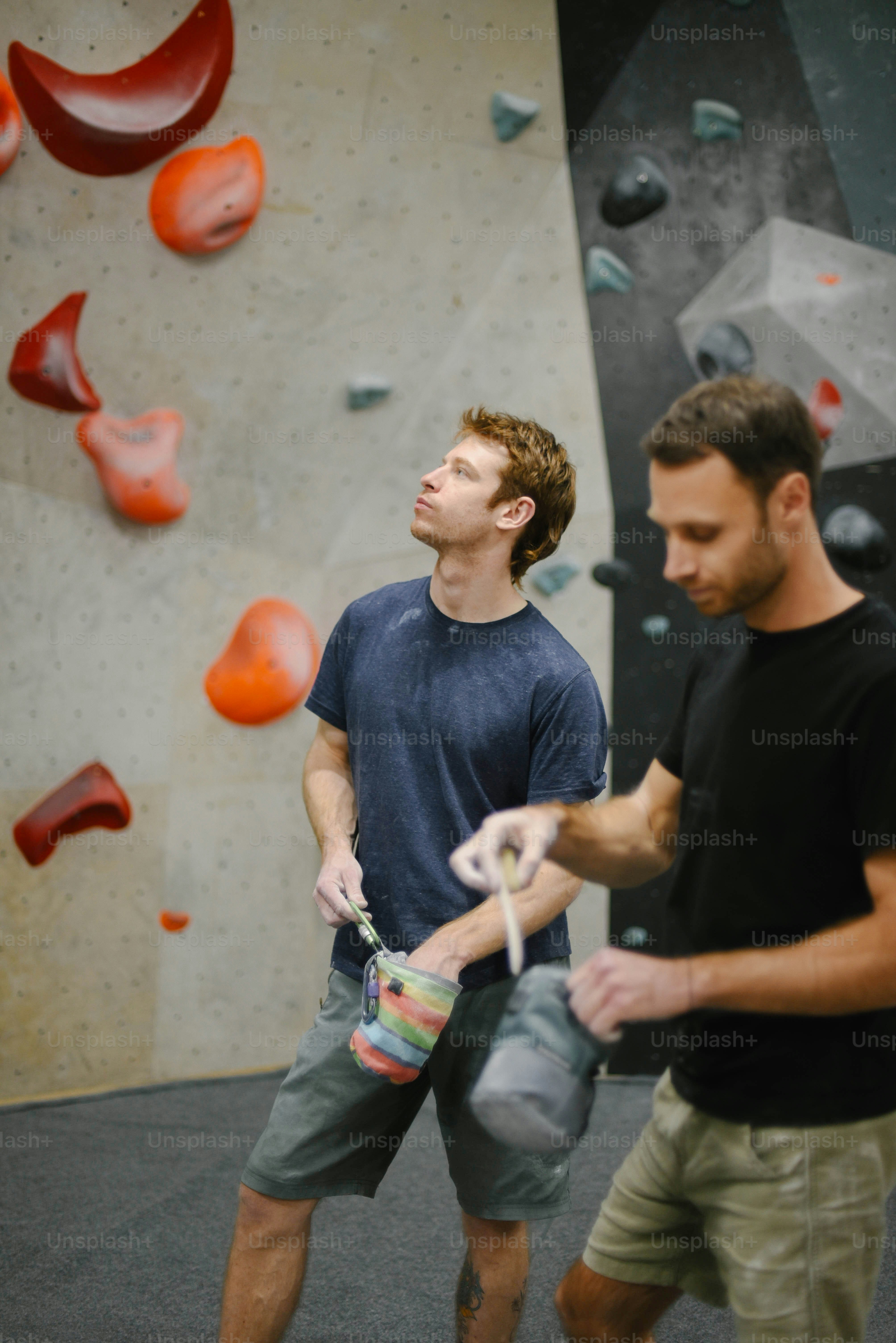 a couple of men standing next to each other