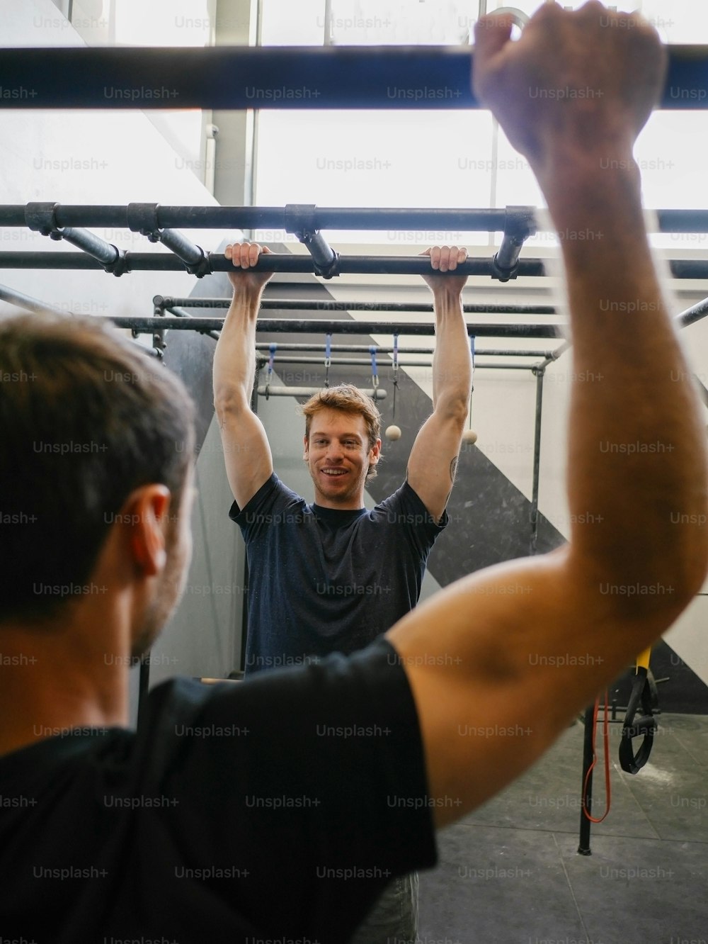 a man lifting a bar in a gym