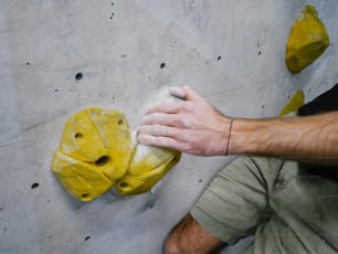 a man is climbing up a rock wall