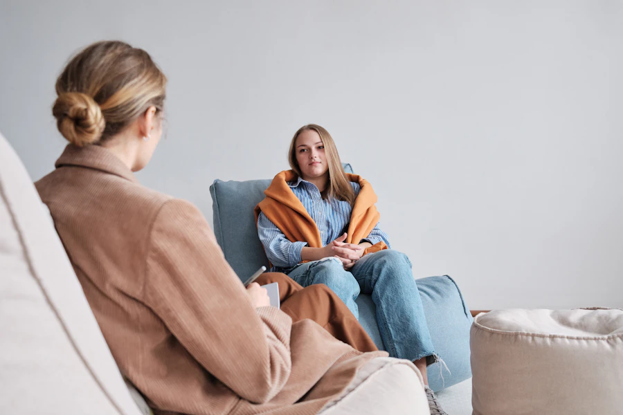 A therapist listening to a client at the start of a counseling session
