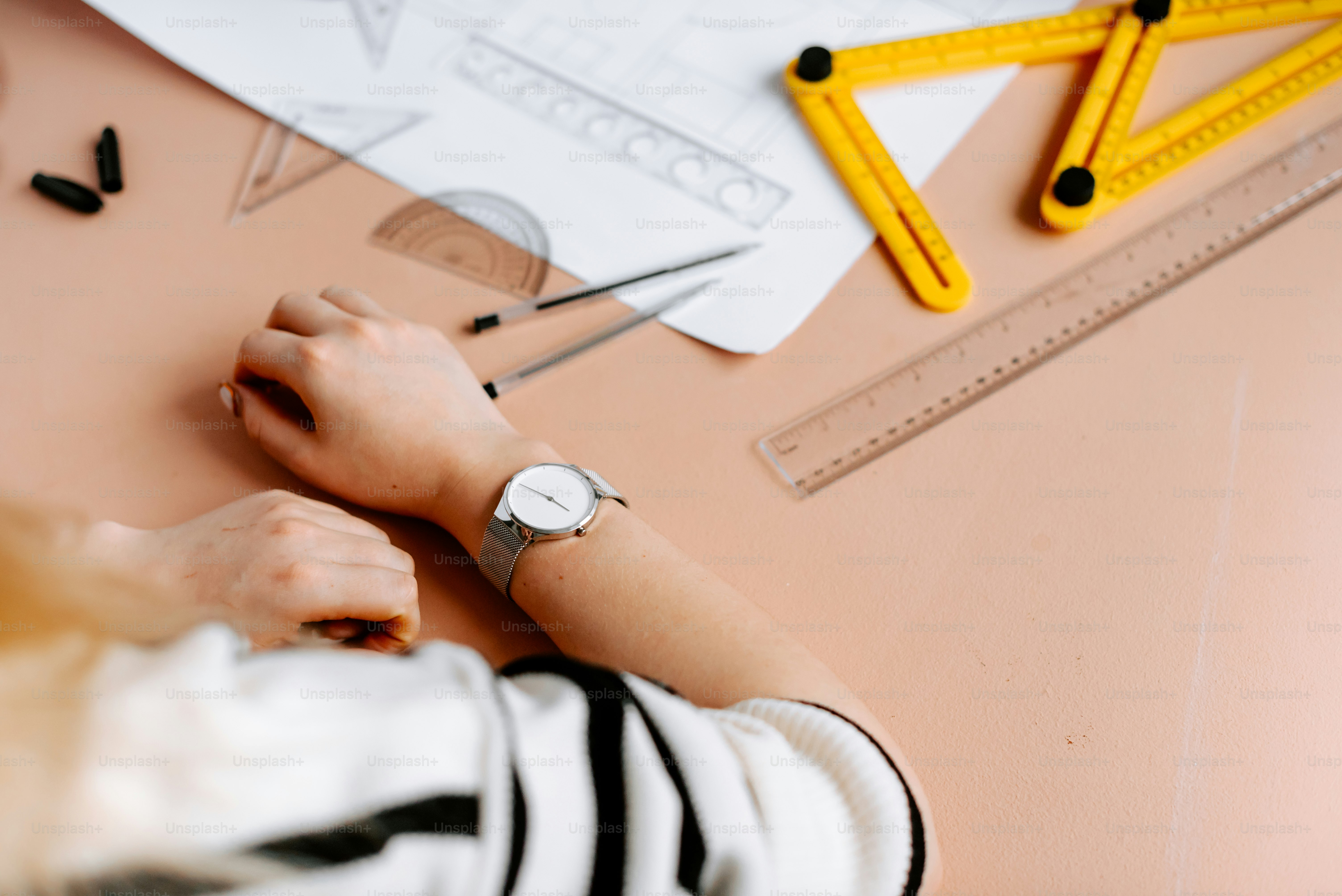 a person with a watch on their wrist