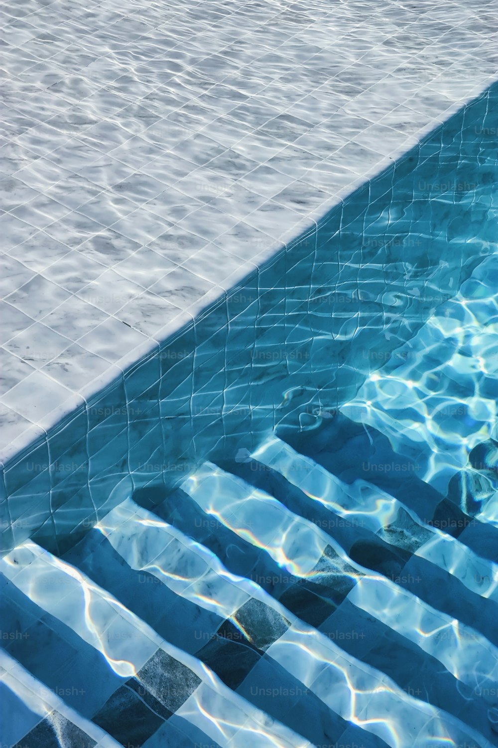 a swimming pool with clear blue water