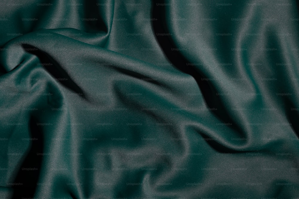 a close up of a dark green fabric