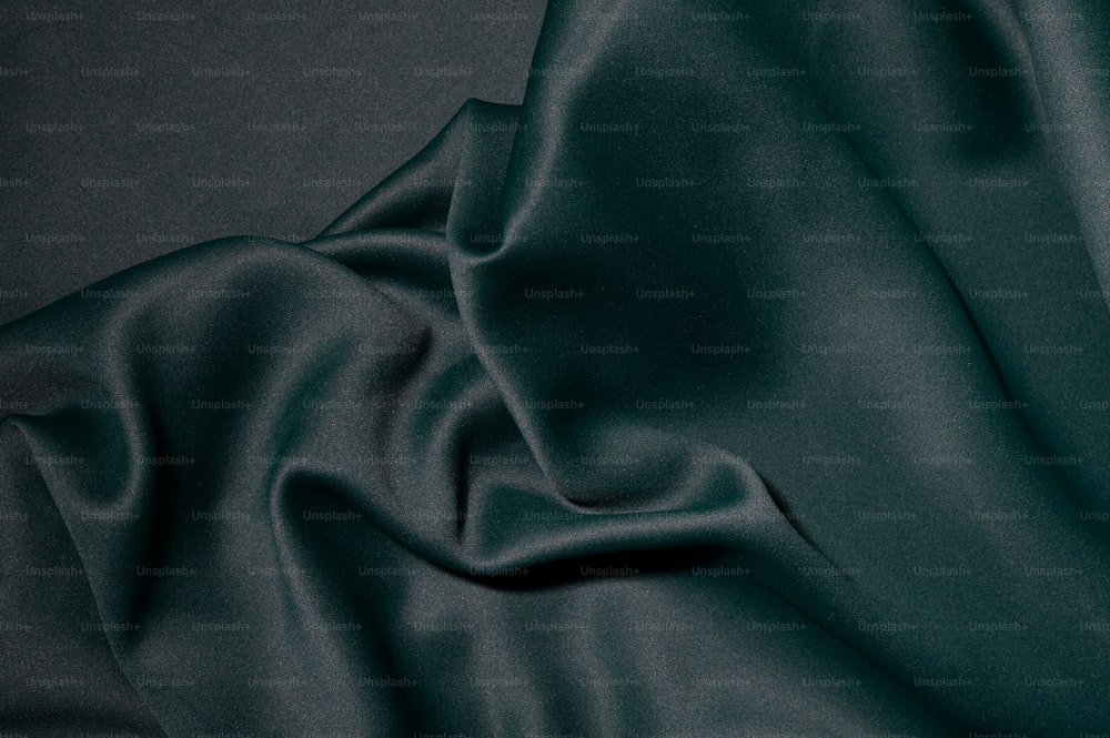 a close up of a dark green fabric