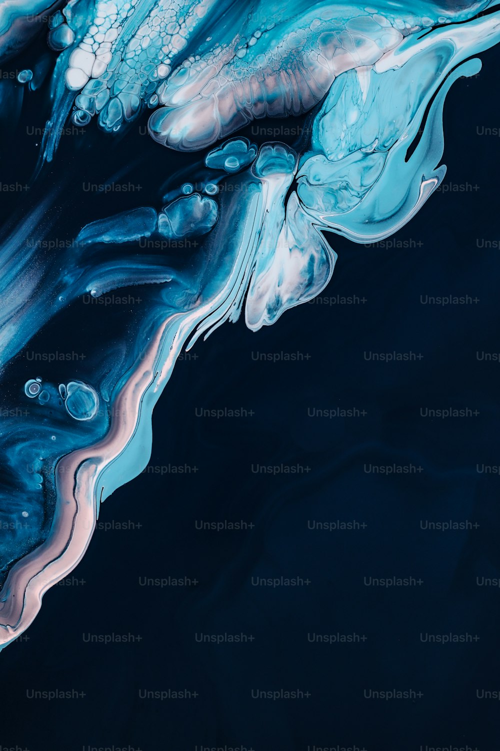 a close up of a blue and white liquid