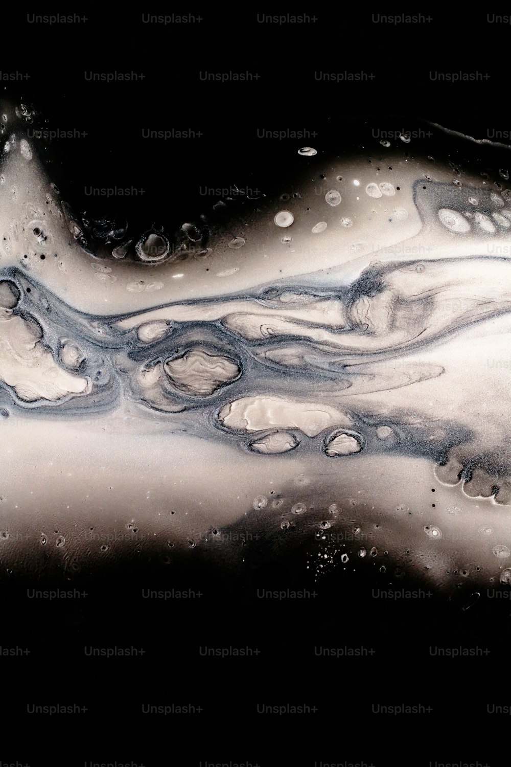 a black and white photo of water and bubbles