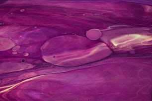 a close up of a purple and yellow liquid