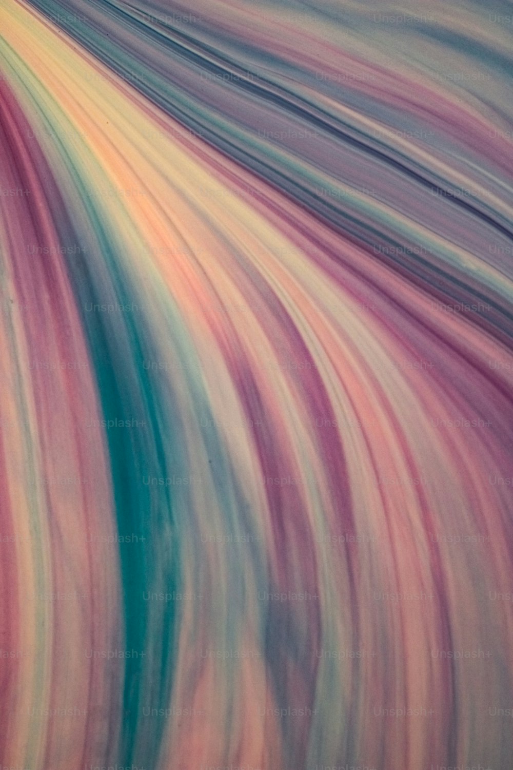 an abstract painting of a multicolored wave