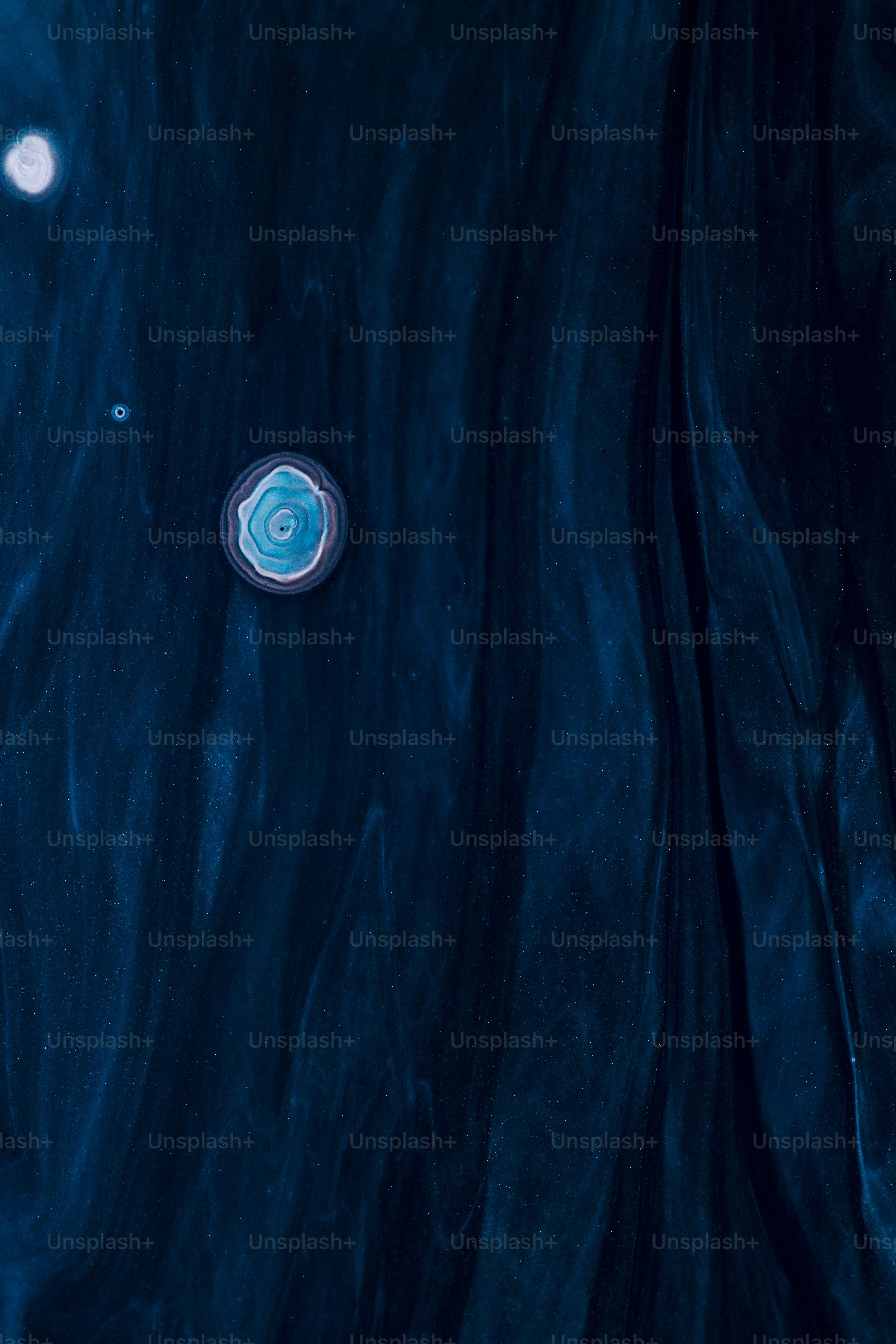 a blue and white object floating in the water