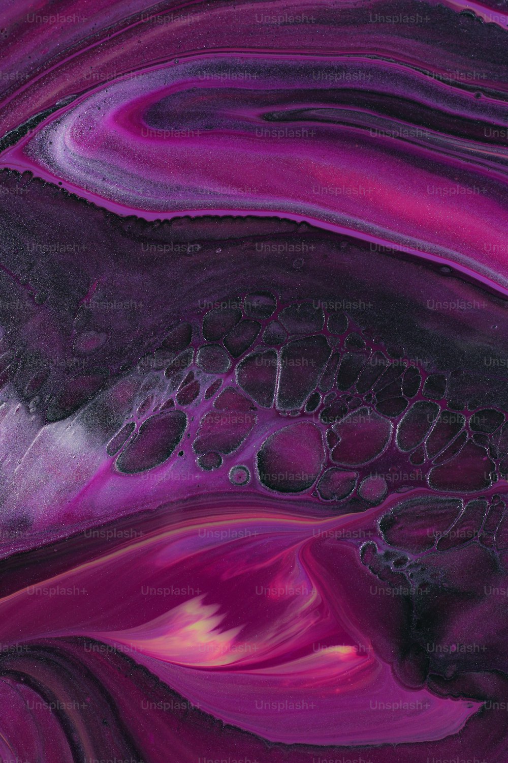 a close up of a purple and black substance