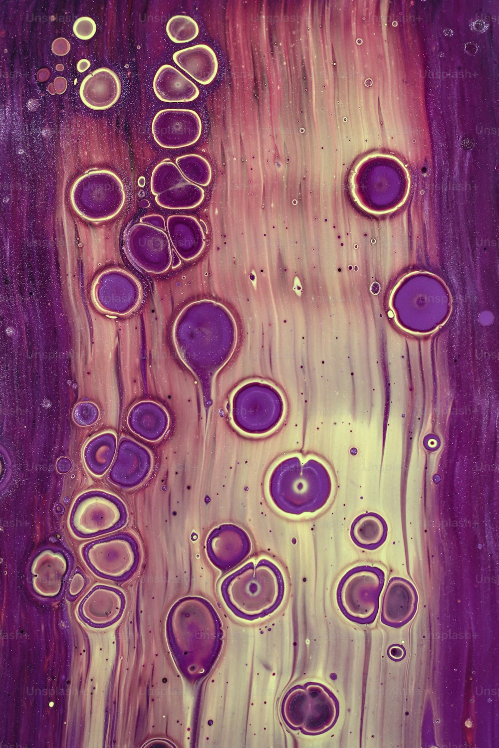 an abstract painting with purple and yellow colors