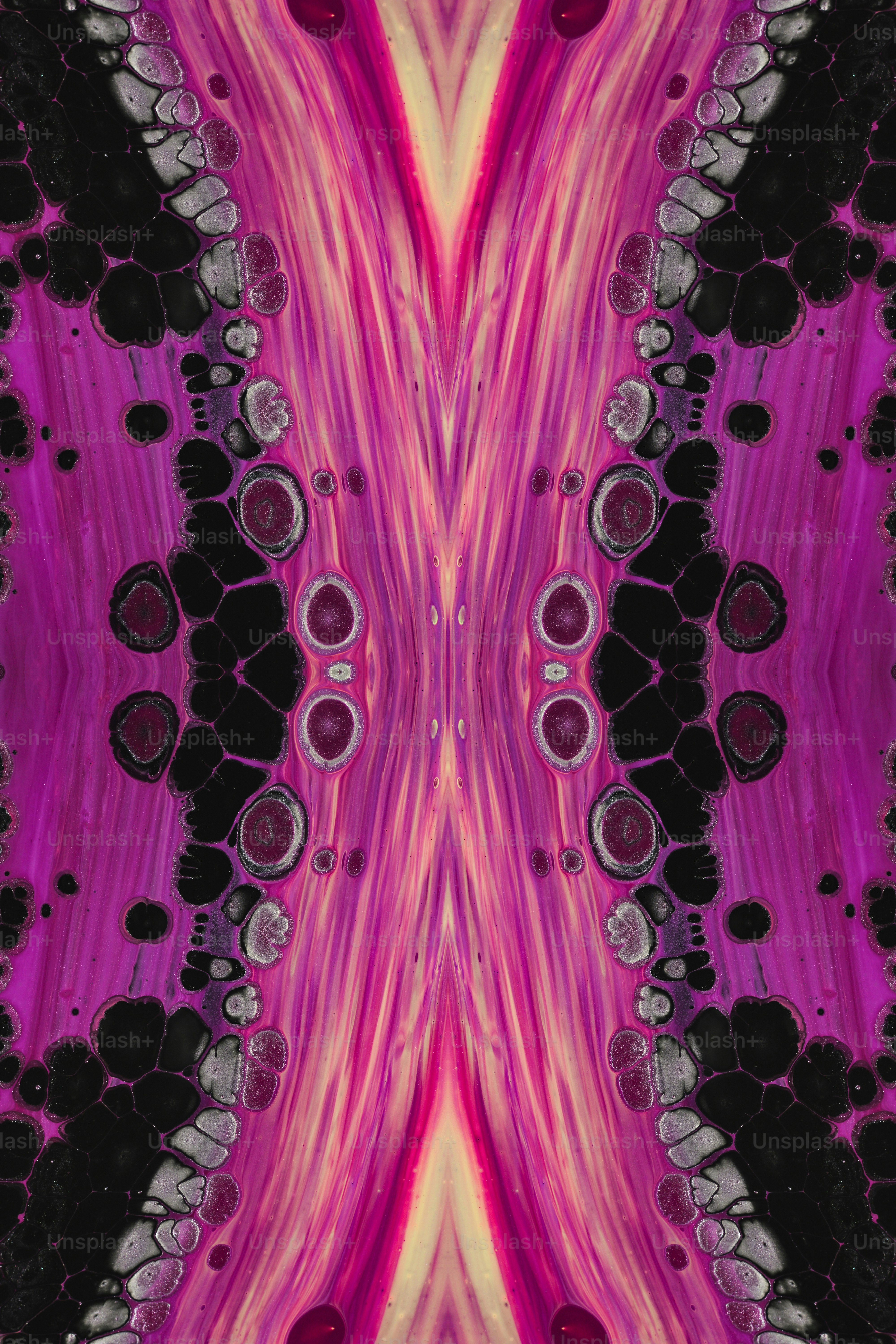 a pink and black abstract design with lots of circles