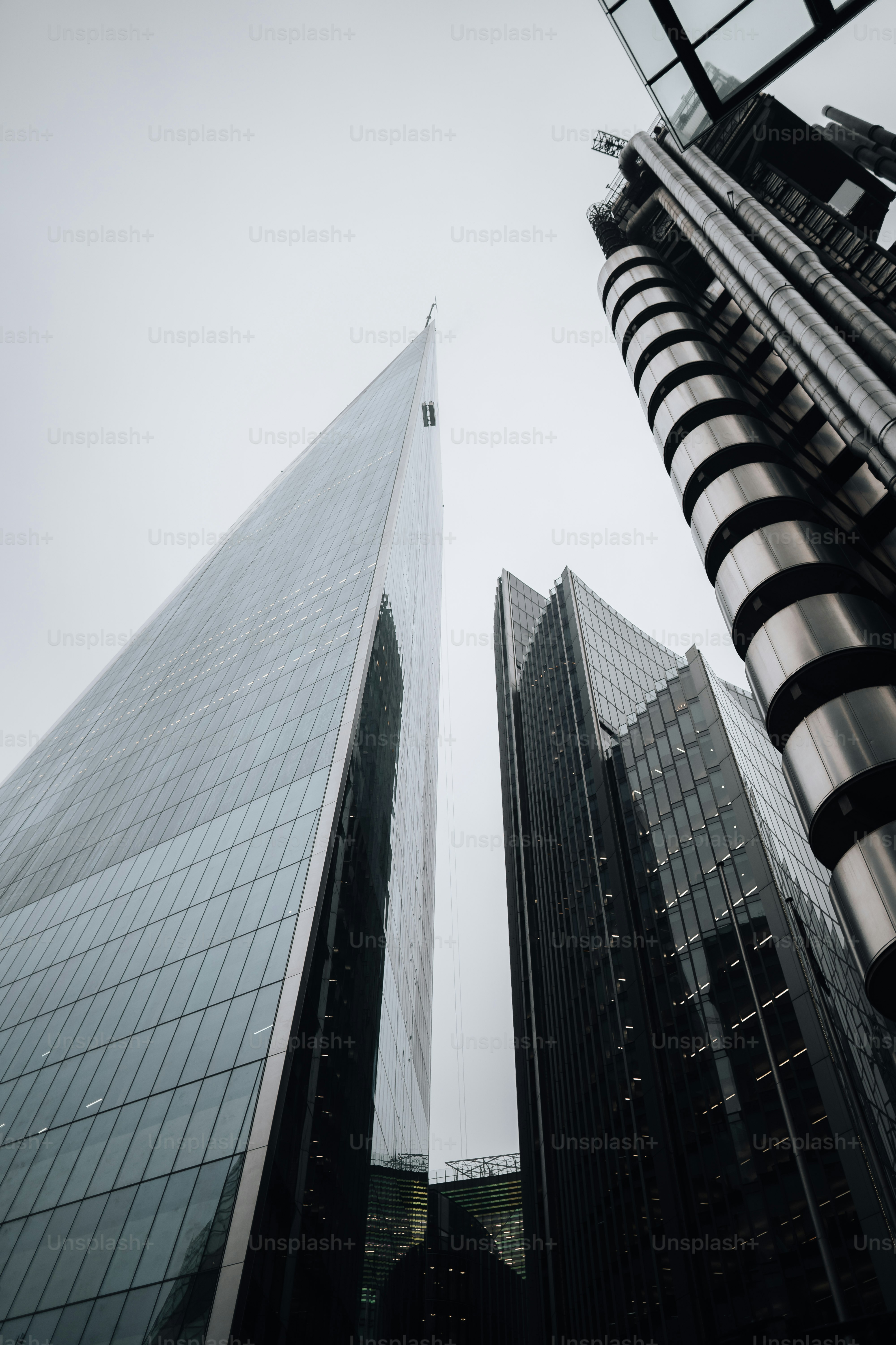 a couple of tall buildings sitting next to each other