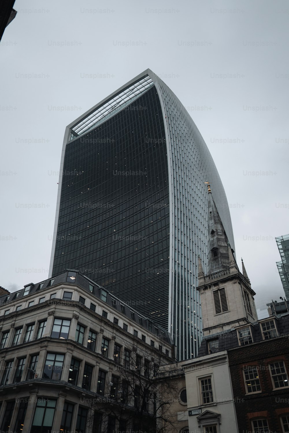 a very tall building with a steeple in the background