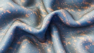 un tissu bleu avec des mouchetures dorées dessus
