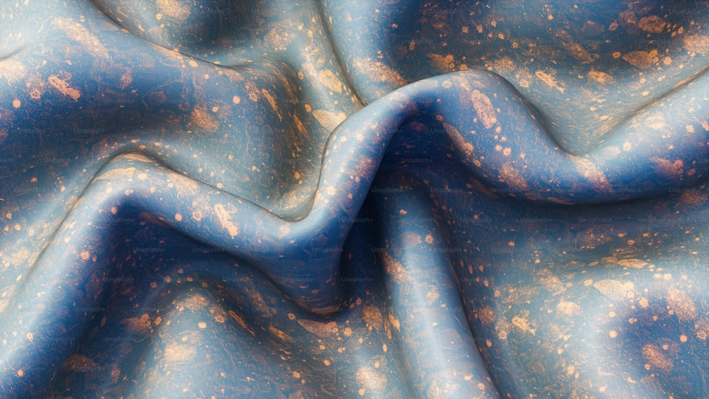 una tela azul con manchas doradas