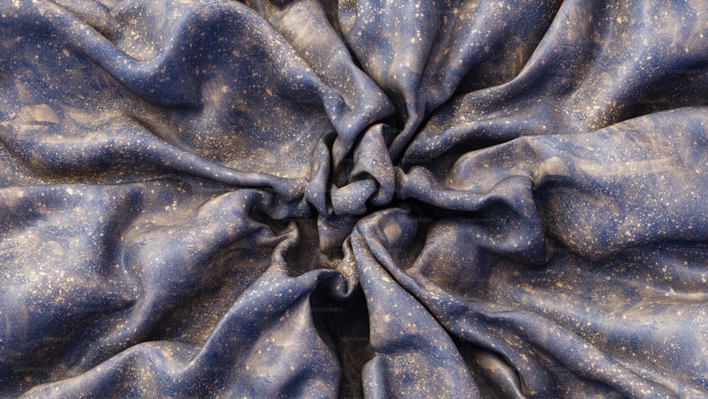 um close up de um tecido azul com manchas de ouro