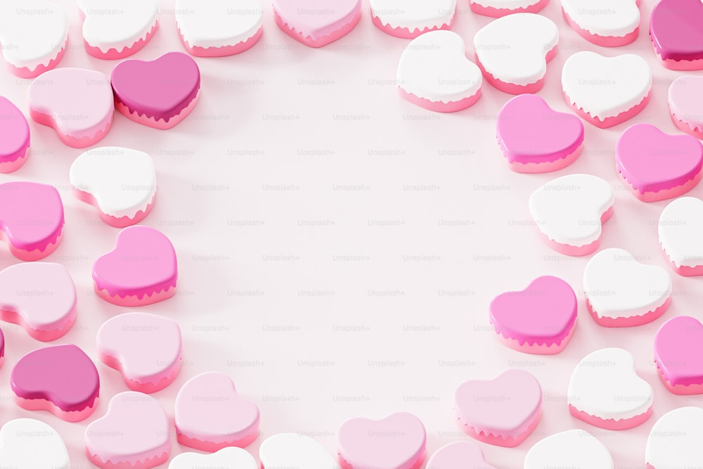 a group of pink and white heart shaped cookies