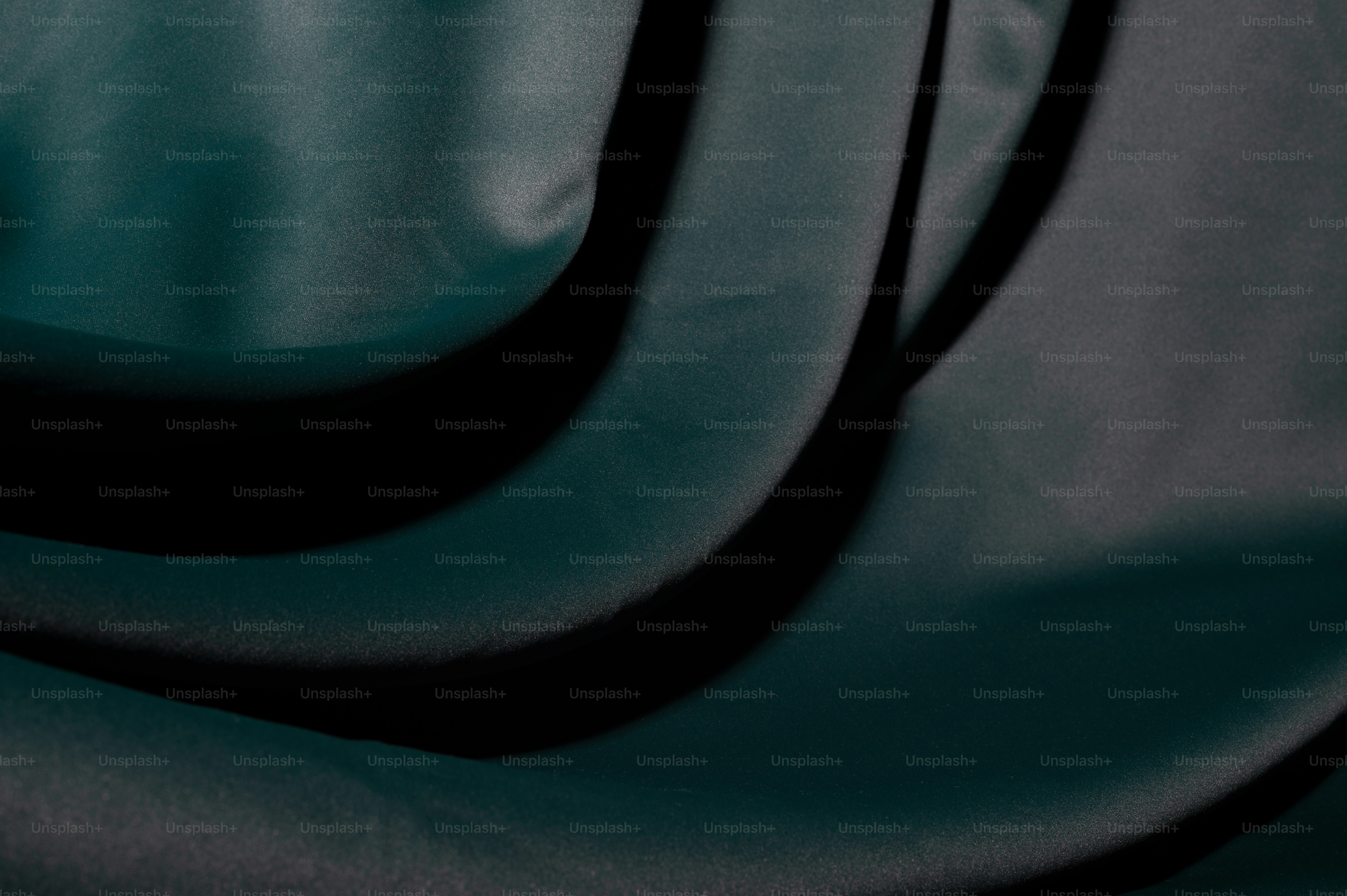 A close up of a dark green fabric photo Green fabric Image on Unsplash